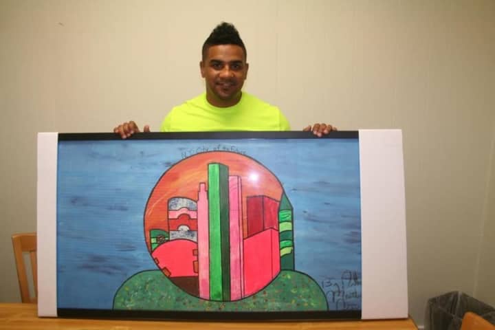 Anthony Martinez of White Plains displays a piece of art he created when he formerly lived at Abbott House in Irvington.