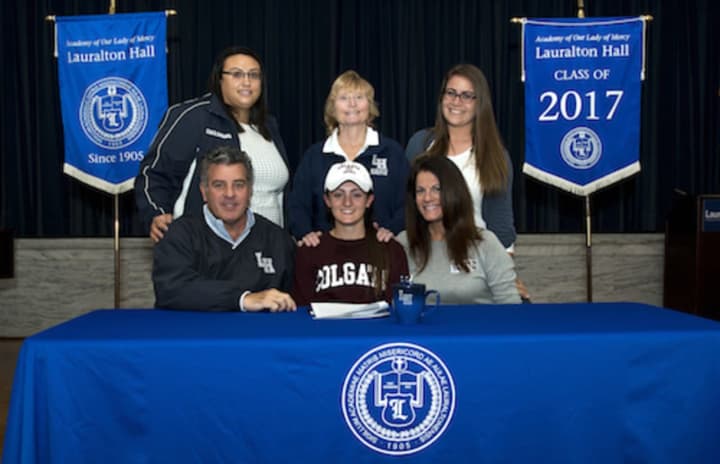 Christiana Cottrell, with her parents Richard Cottrell and Georgia Cottrell; and standing, from left, Amanda Acampora, head softball coach, Jeanne Cooper, athletic director and Christine Miller, assistant softball coach.