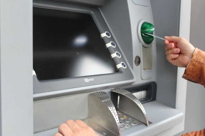 Police arrested 58 people on Thursday, Aug. 20, accused of participating in a scheme to use phony pre-paid debit cards to make withdrawals from Santander Bank ATMs across multiple states - including Connecticut.