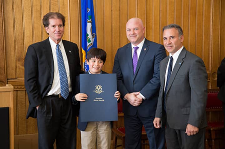 Wesley Elkind of Greenwich is honored by the Greenwich delegation for his winning essay on autism.