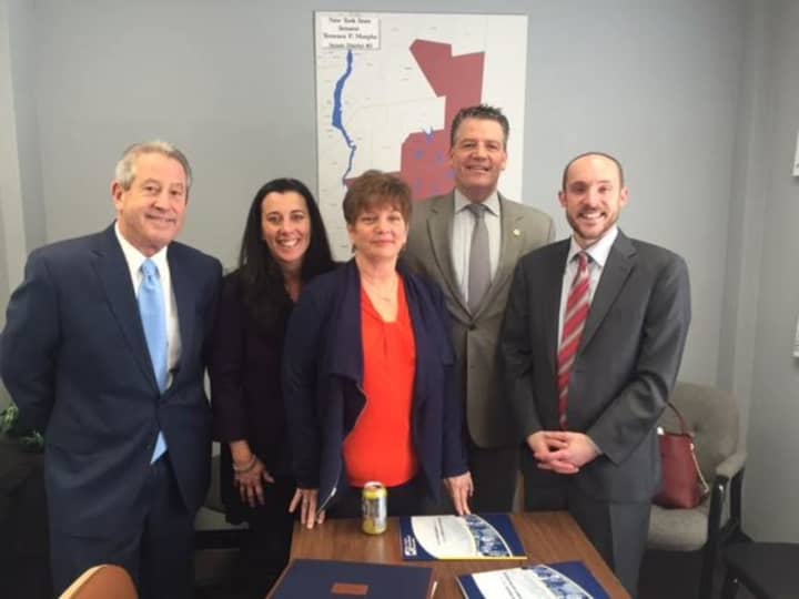 From left, Superintendent George Stone, Board of Education Trustee Denise Kness, Board of Education President Carol Ann Dobson, Sen. Terrence Murphy and Brian Fessler of the New York State School Boards Association.