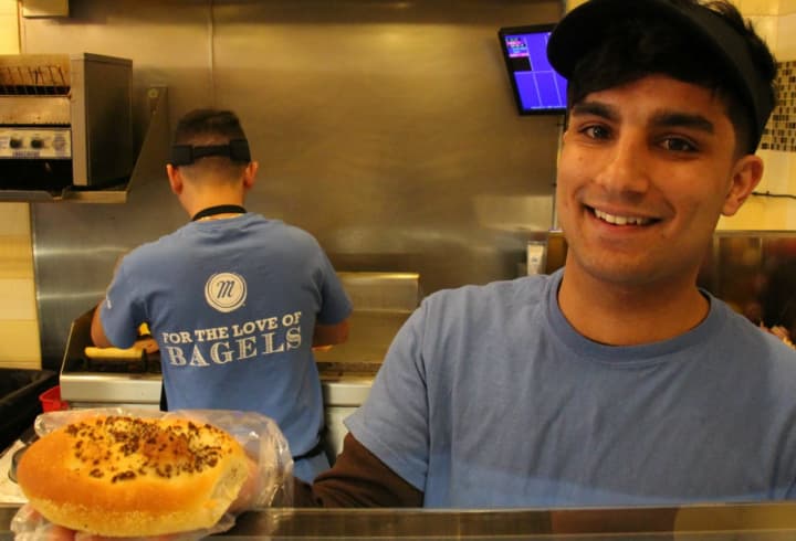 Kais Ghiasi shows off his product in Manhattan Bagel.