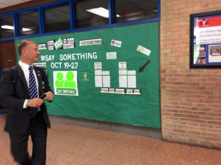 Mark Barden checks out the &#x27;Say Something&#x27; campaign at Danbury High School last fall.