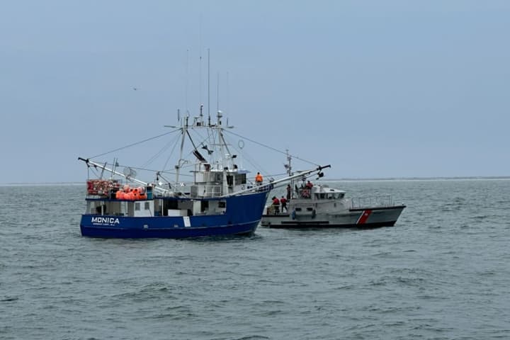 A U.S. Coast Guard Station Barnegat Light 47-foot motor lifeboat crew assists the disabled commercial fishing vessel Monica off the coast of New Jersey on Tuesday, Feb. 27, 2024.
