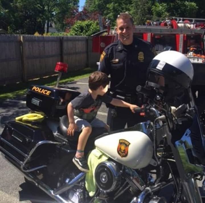 Although his arms were barely long enough to reach the handlebars, one Bedford child got to find out what it feels like to sit on a police motorcycle on the town&#x27;s recent Truck Day.