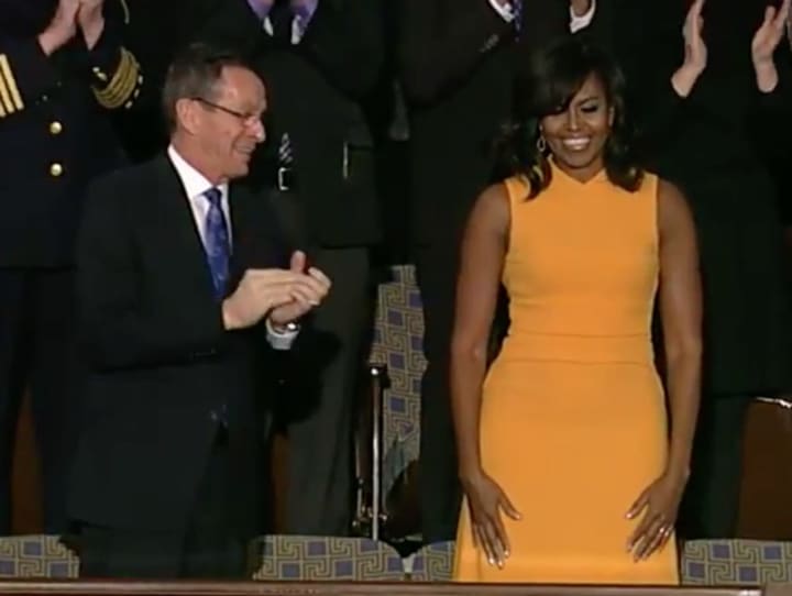 Connecticut Gov. Dannel Malloy greets First Lady Michelle Obama as she arrives at the Capitol for the State of the Union address Tuesday night.