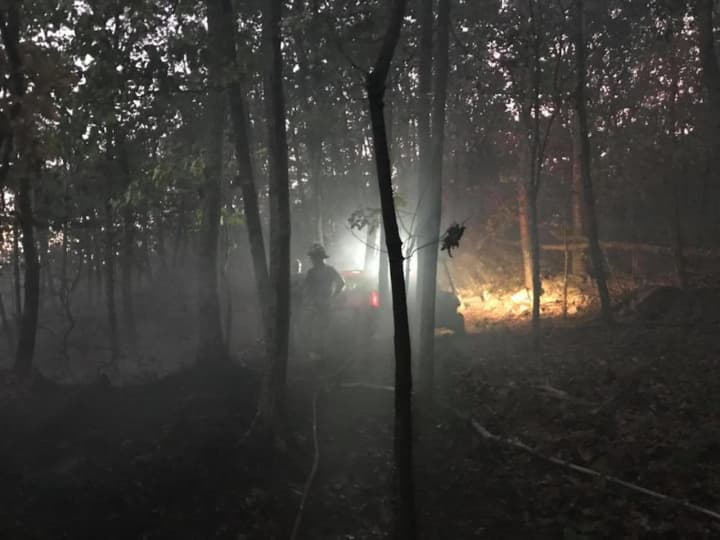 Firefighters from Bethel and surrounding towns battled a brush fire on Tuesday night and Wednesday morning.