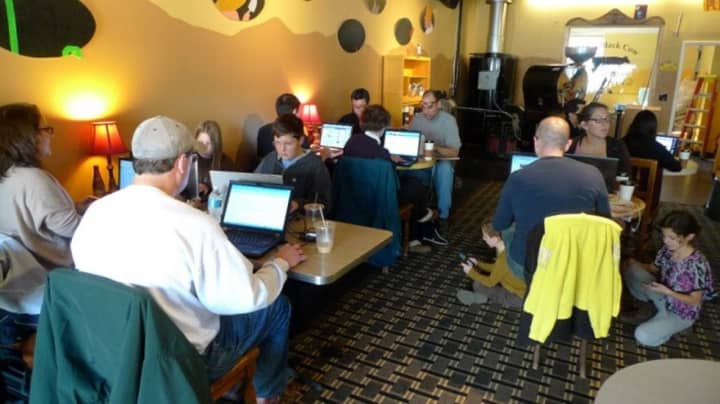 Customers enjoy a little tech with their coffee at The Black Cow in Croton-on-Hudson.