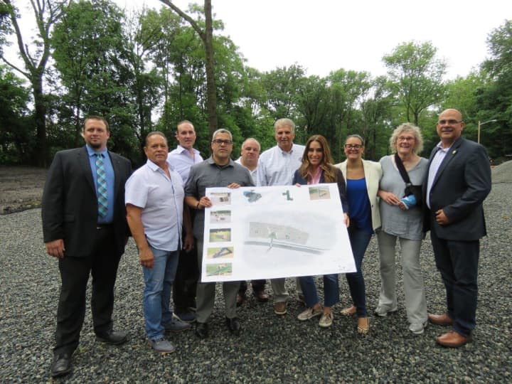 Essex County Executive Joseph N. DiVincenzo, Jr. (sixth from left) announced on Friday that work to create an off-leash dog park in Essex County Branch Brook Park in Newark was underway.