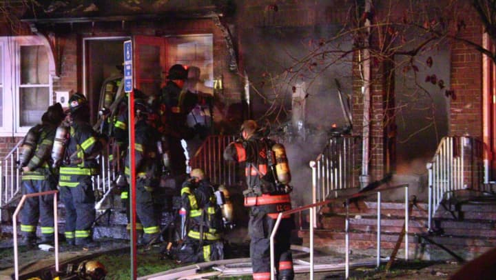 Bridgeport firefighters respond to a blaze at two condos Sunday night near Alanson Road and Connecticut Avenue in Bridgeport. 