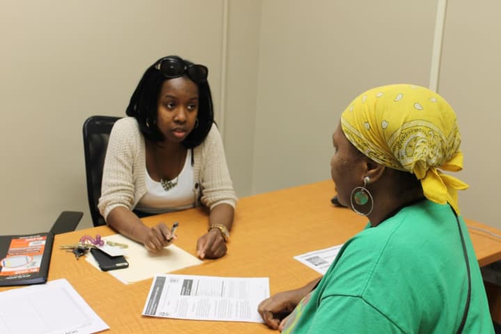 Family Centers Resident Services Coordinator Shawnece Simmons works with a resident of Charter Oak Communities on goal planning.