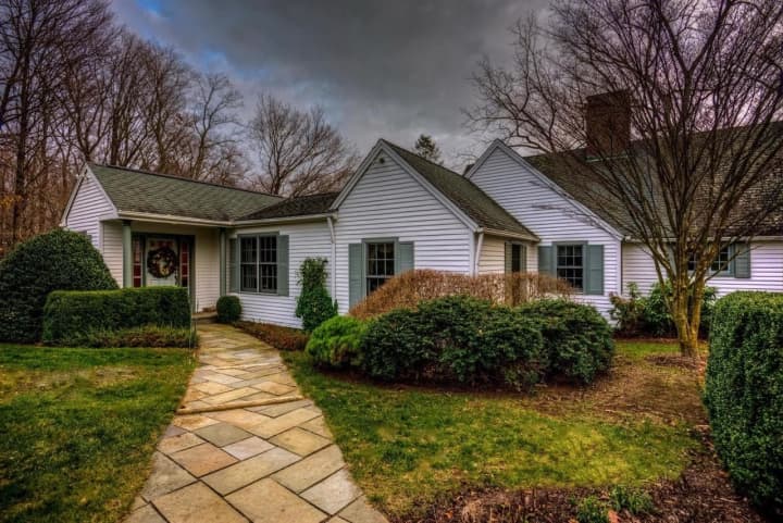 A Wilton Colonial at 148 Hulda Hill Road offers four bedrooms and three park-like acres.