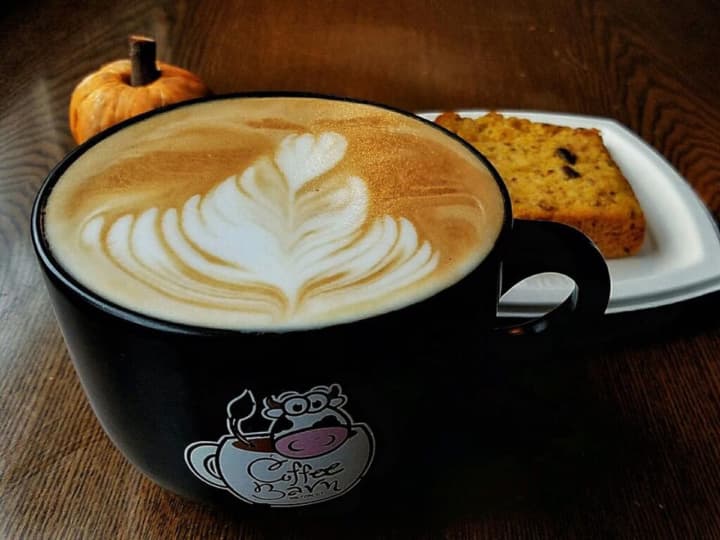 Latte art on a creamy cappuccino at Wilton Coffee Barn.