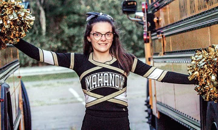 Brandi Levy in her Mohanoy High School cheerleading uniform after she allowed on the team in 2017, following the Snapchat post.