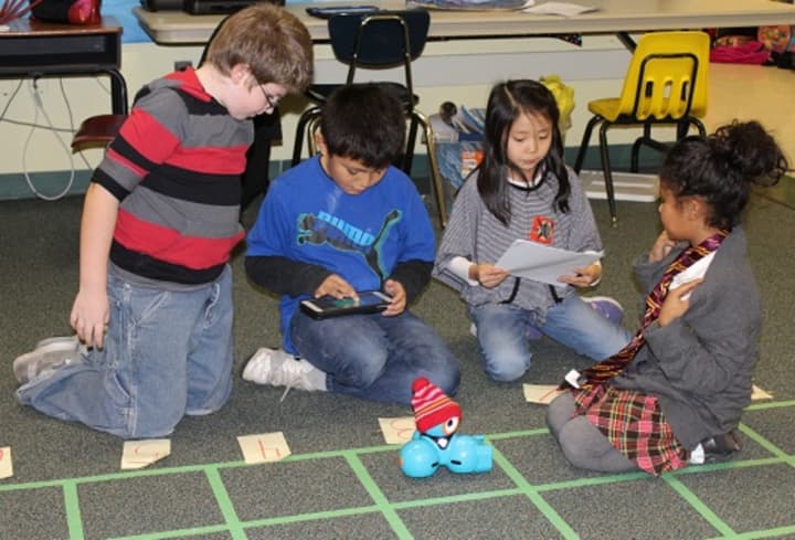 Third-graders at Highview Elementary School work as a team utilizing computer coding skills, trial and error, critical thinking, and math skills to complete seven “missions.&quot;