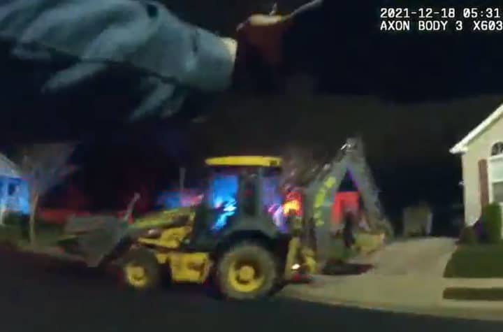 Bodycam footage shows the officer shooting the runaway backhoe driver.