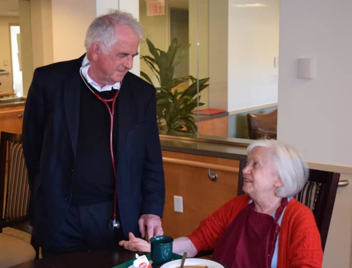 Dr. Francis X. Walsh with a Witherell rehab patient. Walsh, medical director at The Nathaniel Witherell Home in Greenwich, was recently honored with a Doctors of Distinction Award in the category of Lifetime Achievement.