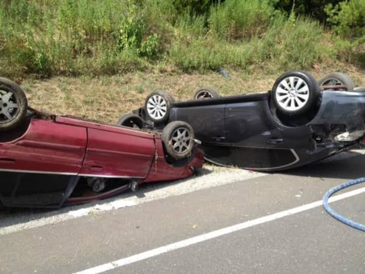 Two people were sent to the hospital after two cars rolled over in an accident Saturday on the southbound Merritt Parkway between exits 47 and 46. 