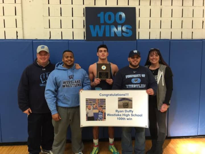 Ryan Duffy, center, is congratulated for his 100th win with the Westlake High School Wildcats. At far right is Ryan&#x27;s mom, Dana; his dad, Michael, far left. Coach Randy Rodriguez is second from right; assistant coach John Lopez, second from left.