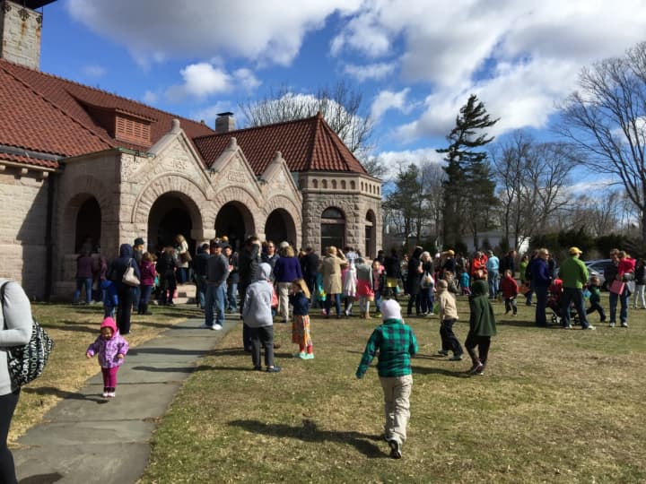Children and families gather on Pequot Library&#x27;s Great Lawn during the 9th annual Easter Egg Roll last March. This year&#x27;s community-wide event is March 26.