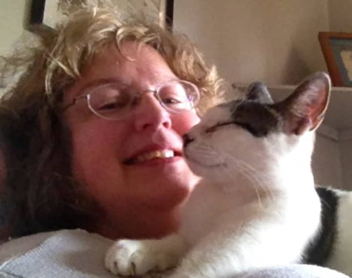 PAWS&#x27; Cat Adoption Coordinator Ellen Emerson with her own cat, Topsy.