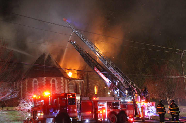Firefighters attack the blaze at a historic church in Englewood.