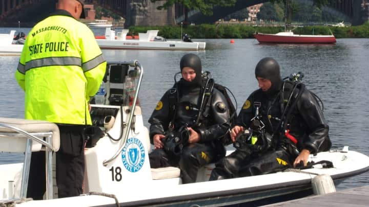 Massachusetts State Police divers, seen here in an unrelated search, are one of several police agencies that took part in a late-night search on Friday, July 21, to find the body of a 17-year-old girl after the boat she was on crashed into a jetty.