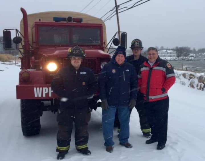 Westport First Selectman Jim Marpe joined Deputy Chief Bob Kepchar and firefighters Scott Delvecchio and Toby Ostapchuk on Harbor Road at noon where the snow had turned to wind-blown sleet and rain.