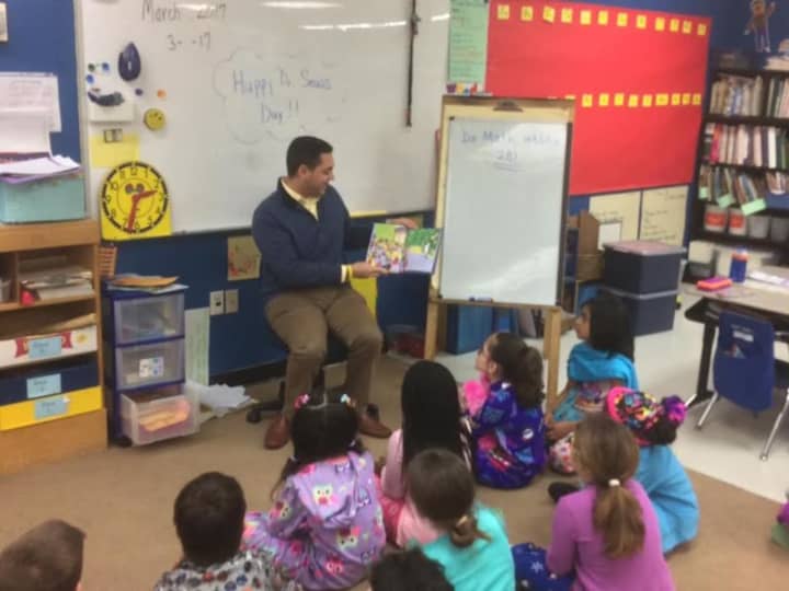 State Representative Michael Ferguson reads to second graders Thursday at King Street Primary School in Danbury.