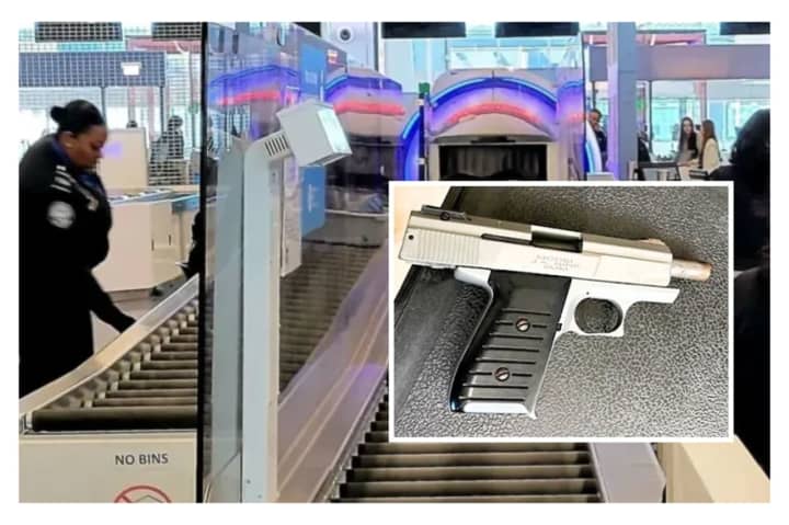 A woman headed to work in one of the Newark Airport retail shops was caught with a loaded 9mm handgun, the TSA said.