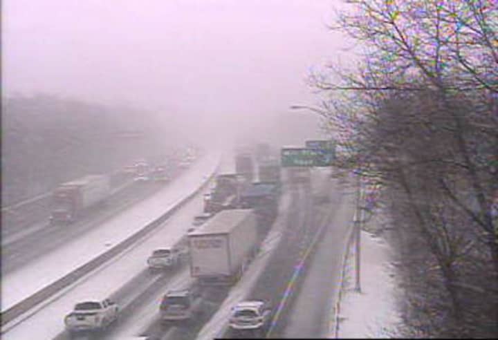 Traffic is backed up on I-95 north at Pine Creek Road in Fairfield on a snowy Monday morning.