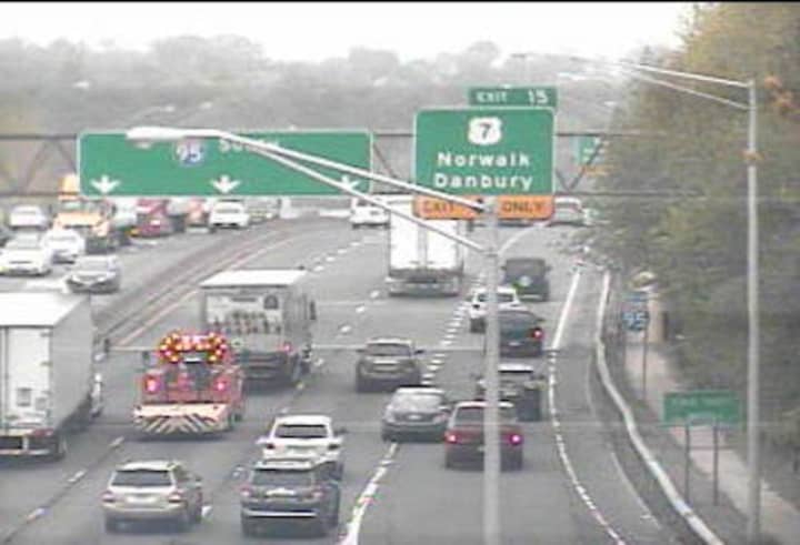 A truck is blocking the center lane of I-95 in Norwalk.