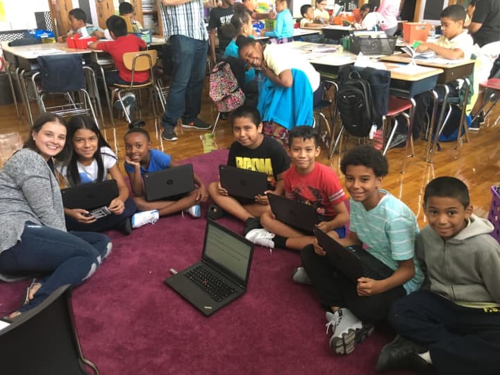 Students at PS 9 Ryer Avenue Elementary School, Bronx, N.Y,  use their Chromebooks. Their teacher Rosemary Garabito of Garnerville started a fundraiser to buy the laptops for students there.