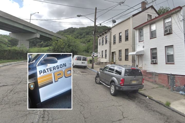 Paterson police raided an apartment in the Spruce Street house at the far right in this photo.