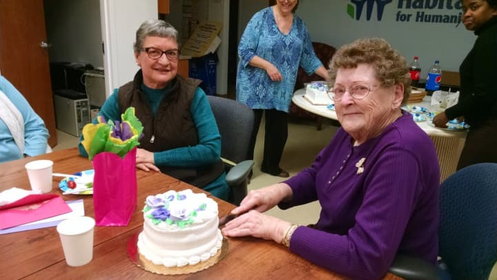 Betty McPherson, right, celebrates her 90th birthday at Habitat for Humanity of Coastal Fairfield County.