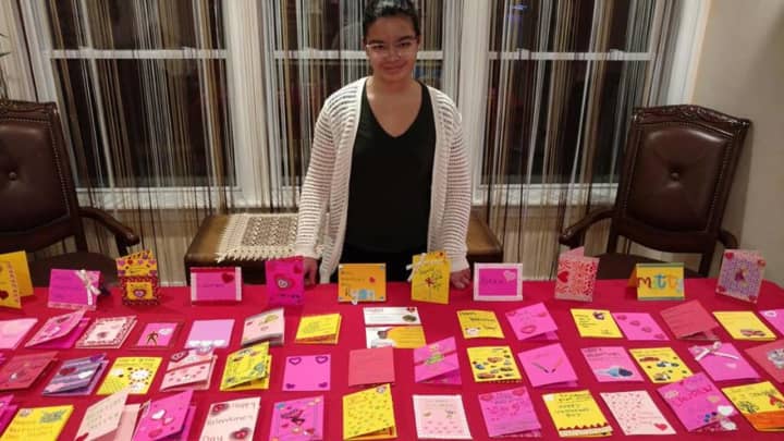 Grace Targonski of Stamford shows the Valentine&#x27;s Day cards she and friends made for childhood cancer patients.