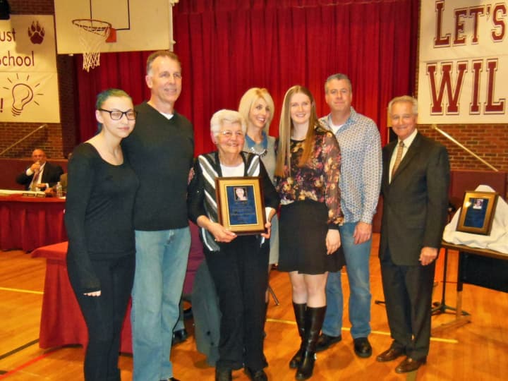 Grace McGee with her family and East Rutherford Board of Education members at the recent East Rutherford Board of Education meeting at which she was honored.