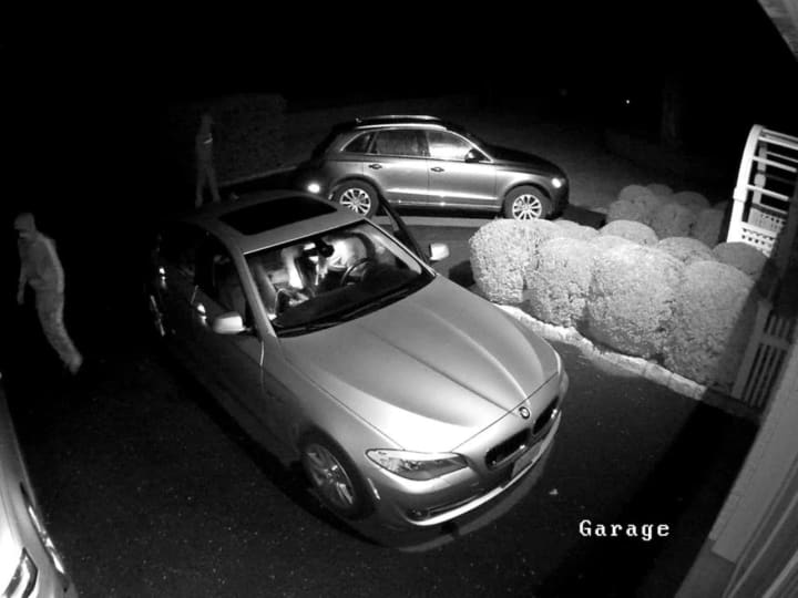 Surveillance photo of car thieves hitting unlocked vehicles in Greenwich