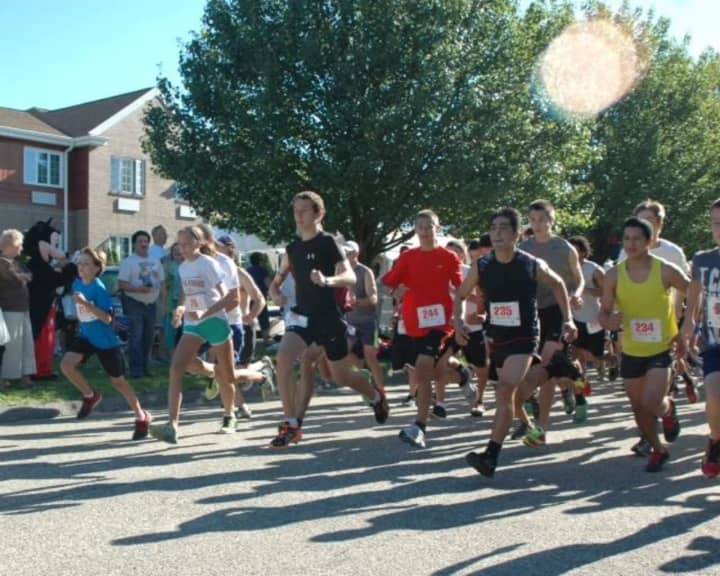 Runners compete in a past Village Halloween 5K &amp; Fun Walk, which takes place Saturday, Oct. 29, in Shelton.
