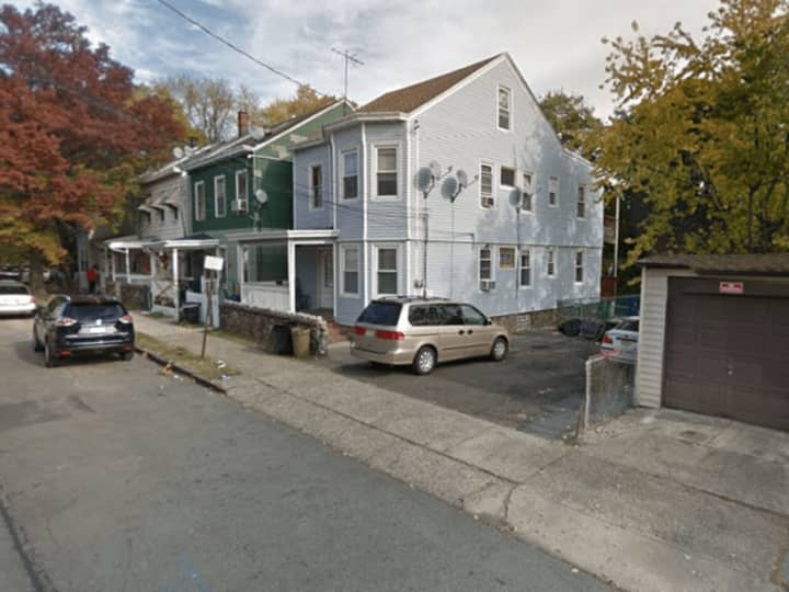 Paterson drug detectives raided Hopper Street home (right).