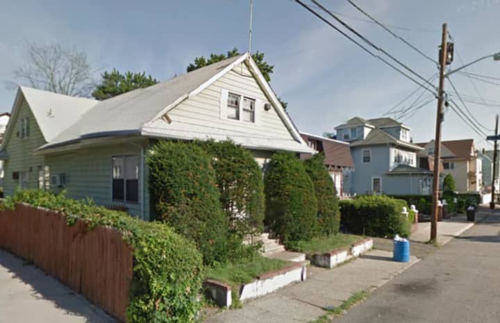 Rui Zhou was gunned down in front of this house on East 34th Street in Paterson.