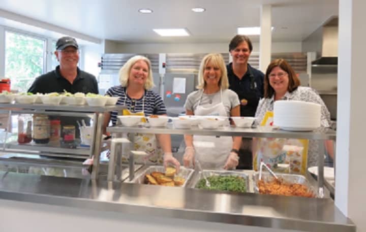 <p>A team of volunteers from Hudson Peak Wealth Advisors in Pleasantville participate in a &quot;Day of Service&quot; at the Open Arms Men&#x27;s Shelter in White Plains. From left are Eric Nachman, Pam Wetherbee, Patricia Hughes, Darrel Upson and Ann Herrero.</p>