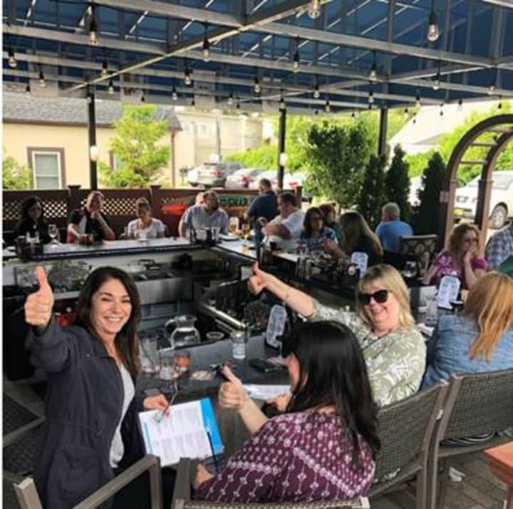 Customers sit outside on a new patio at Augie&#x27;s Prime Cut steakhouse in Yorktown.