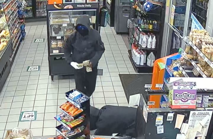 Robbers at work in the 7-Eleven at the Sunoco station on eastbound Route 46 in Palisades Park.