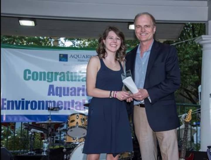 Shelton High School’s Marissa Peck, with Aquarion’s President and CEO Charles Firlotte, is recognized at the 7th annual Aquarion Environmental Champion Award ceremony June 3 at Beardsley Zoo for her salt water dissolvable plastics project.