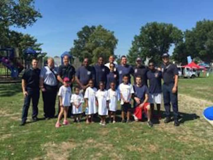 Members of the Stamford Professional Fire Fighters Association got together with city youngsters recently on the tennis courts. The get-to-know-you games took place at Family Fun Day in Cummings Park.