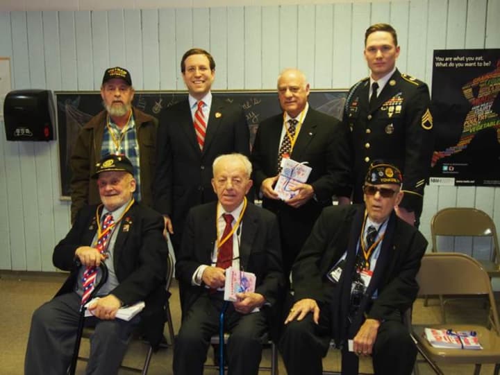 Assemblyman David Buchwald stands with veterans at West Patent Elementary School in Bedford Hills during the Valentines for Vets launch assembly on Thursday.