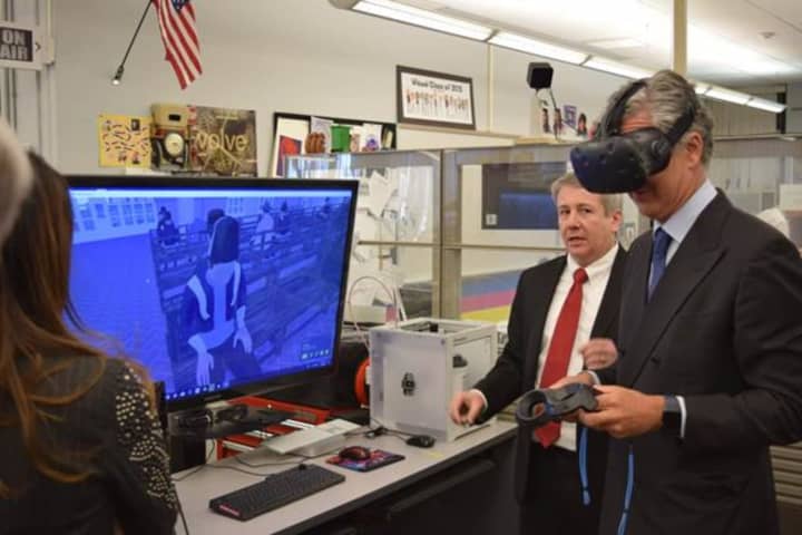 Italian Consulate General Francesco Genuardi tests out the high-tech learning tools at Bergen Academies in Hackensack.