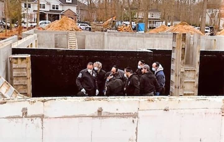 Rescuers at the Lakewood site of the worker&#x27;s fall.