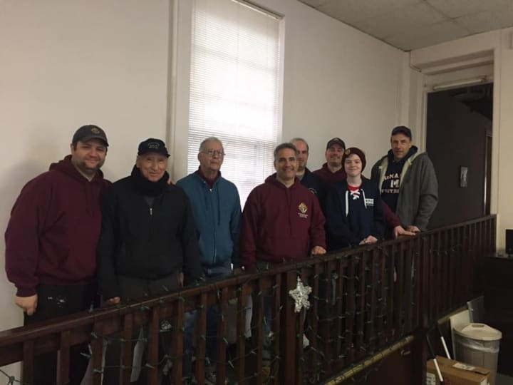 Members of the Norwalk Knights of Columbus and Fairfield student Sean Mitchell helped the Notre Dame Convalescent Home get ready for winter by winterizing its windows.